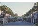 Neighborhood street with palm trees and buildings in The Villages, Florida at 3023 Charlevoix St, The Villages, FL 32163