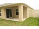 Covered patio overlooks the fenced backyard and a sliding glass door allows inside access at 356 Se 66Th Ct, Ocala, FL 34472