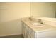 Bathroom with double sinks and a large mirror over bright white cabinets at 356 Se 66Th Ct, Ocala, FL 34472