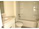 Bathroom featuring a white vanity, commode and a shower/tub combo with tile surround at 356 Se 66Th Ct, Ocala, FL 34472