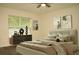 Inviting bedroom featuring a stylish dresser, neutral tones, and ceiling fan at 356 Se 66Th Ct, Ocala, FL 34472