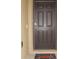 A secure brown front door provides a welcoming entrance and home security at 356 Se 66Th Ct, Ocala, FL 34472