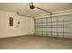 Spacious garage with an automatic door and ample room for vehicles and storage at 356 Se 66Th Ct, Ocala, FL 34472