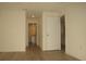Bright hallway with wood floors leading to the bathroom featuring a white vanity at 356 Se 66Th Ct, Ocala, FL 34472