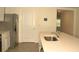 Kitchen with stainless steel refrigerator, white countertops, and tiled floors at 356 Se 66Th Ct, Ocala, FL 34472