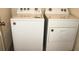 Laundry room featuring modern, white Whirlpool washer and dryer units at 356 Se 66Th Ct, Ocala, FL 34472