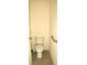 Close up of toilet and adjacent wall with TP holder and grab bar at 356 Se 66Th Ct, Ocala, FL 34472