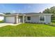 Charming single-story home with a well-manicured lawn, attached garage, and neatly landscaped front yard at 4365 Sw 151St St, Ocala, FL 34473