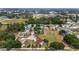 Wide aerial view of a home surrounded by lush greenery and neighboring houses in a tranquil community at 4620 Sw 42Nd St, Ocala, FL 34474