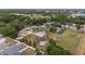 Wide aerial view of a home situated on a large lot with mature trees and surrounding neighborhood at 4620 Sw 42Nd St, Ocala, FL 34474