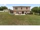 Rear exterior of the home with a lawn, patio, and outdoor seating at 4620 Sw 42Nd St, Ocala, FL 34474