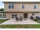 Large backyard features a patio with a table and seating, perfect for outdoor enjoyment at 4620 Sw 42Nd St, Ocala, FL 34474