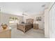 Comfortable bedroom with a large window, ceiling fan, and soft natural light at 4620 Sw 42Nd St, Ocala, FL 34474