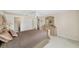 Well-lit bedroom with carpet, ceiling fan, closet, and a soft natural light at 4620 Sw 42Nd St, Ocala, FL 34474