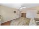 Cozy bedroom featuring carpet flooring, a ceiling fan, and double door closet at 4620 Sw 42Nd St, Ocala, FL 34474