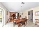 Open-concept dining area with view to living room and outdoor area at 4620 Sw 42Nd St, Ocala, FL 34474