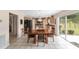 Dining area features tile floors, modern chandelier, and backyard access at 4620 Sw 42Nd St, Ocala, FL 34474