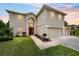 Two-story home with a two-car garage, well-manicured lawn, and inviting front entrance at 4620 Sw 42Nd St, Ocala, FL 34474