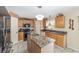 Kitchen featuring granite counters, ample cabinetry, and modern lighting at 4620 Sw 42Nd St, Ocala, FL 34474
