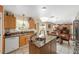 Modern kitchen with central island, sink, and granite counters at 4620 Sw 42Nd St, Ocala, FL 34474