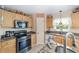 Well-equipped kitchen with a range, microwave, and granite countertop at 4620 Sw 42Nd St, Ocala, FL 34474