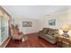 Welcoming living room featuring hardwood floors, neutral paint, and comfortable seating at 4620 Sw 42Nd St, Ocala, FL 34474