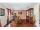 Living room with hardwood floors, a china cabinet, and window views at 4620 Sw 42Nd St, Ocala, FL 34474