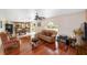 Inviting living room with wood floors, ceiling fan and furniture at 4620 Sw 42Nd St, Ocala, FL 34474
