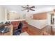 Spacious loft area featuring wood floors, comfortable seating, and a ceiling fan at 4620 Sw 42Nd St, Ocala, FL 34474