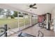 Bright workout room with workout equipment, tile flooring, and backyard views through sliding glass windows at 4620 Sw 42Nd St, Ocala, FL 34474