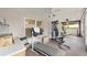 Sunroom with workout equipment including treadmill, weight machine, and ceiling fans at 4620 Sw 42Nd St, Ocala, FL 34474