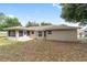 Backyard with patio and views of the enclosed sunroom at 4886 Nw 30Th Pl, Ocala, FL 34482
