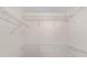Spacious walk-in closet with white wire shelving for ample storage at 4886 Nw 30Th Pl, Ocala, FL 34482