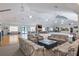 Large common area with comfortable seating, tables, a kitchen area and a TV at 4886 Nw 30Th Pl, Ocala, FL 34482