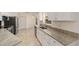 Spacious kitchen with stainless steel appliances, granite counters, and ample white cabinet space at 4886 Nw 30Th Pl, Ocala, FL 34482
