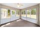 Bright sunroom offering tranquil views of the backyard at 4886 Nw 30Th Pl, Ocala, FL 34482