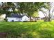 Spacious yard featuring mature shade trees, established landscaping, and well maintained lawn at 5351 Sw 80Th Pl, Ocala, FL 34476