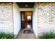 Inviting entryway with brick accents, leading into a bright and open dining area at 5351 Sw 80Th Pl, Ocala, FL 34476
