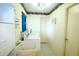 Functional laundry room equipped with washer, dryer, utility sink and ample storage at 5351 Sw 80Th Pl, Ocala, FL 34476