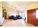 Bright living room featuring hardwood floors, a ceiling fan, and a cozy seating area at 5351 Sw 80Th Pl, Ocala, FL 34476