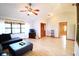 Inviting living room with vaulted ceilings, a ceiling fan, and hardwood floors at 5351 Sw 80Th Pl, Ocala, FL 34476