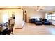 Spacious living area with hardwood floors and views of the kitchen and dining room at 5351 Sw 80Th Pl, Ocala, FL 34476