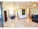 Open-concept living and dining area with hardwood floors and plenty of natural light at 5351 Sw 80Th Pl, Ocala, FL 34476