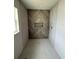 Modern bathroom shower stall featuring wood-look tile, recessed shelf, and minimalist design at 5359 Nw 55Th Pl, Ocala, FL 34482