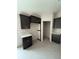 Kitchen view shows ample cabinet space and a designated area for a refrigerator at 5359 Nw 55Th Pl, Ocala, FL 34482