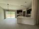 Open concept living and kitchen area with dark cabinets and a breakfast bar at 5359 Nw 55Th Pl, Ocala, FL 34482