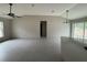 Open concept living and kitchen area with ceiling fan and modern light fixtures at 5359 Nw 55Th Pl, Ocala, FL 34482
