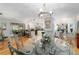 Open dining room with chandelier lighting adjacent to an updated kitchen space at 5521 Sw 31St St, Ocala, FL 34474