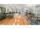 Open-concept kitchen with modern appliances and hardwood floors that connect to a dining area at 5521 Sw 31St St, Ocala, FL 34474