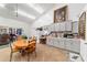 Kitchenette area featuring a dining table, gray cabinets, and appliances at 5521 Sw 31St St, Ocala, FL 34474